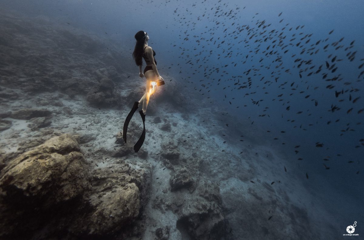 girl with bigblue light underwater